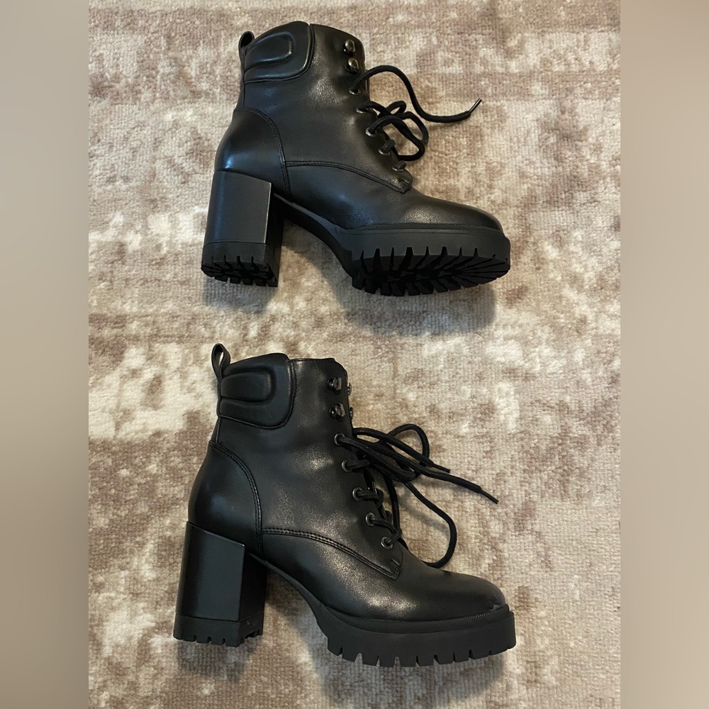 Black heeled lace up leather boots